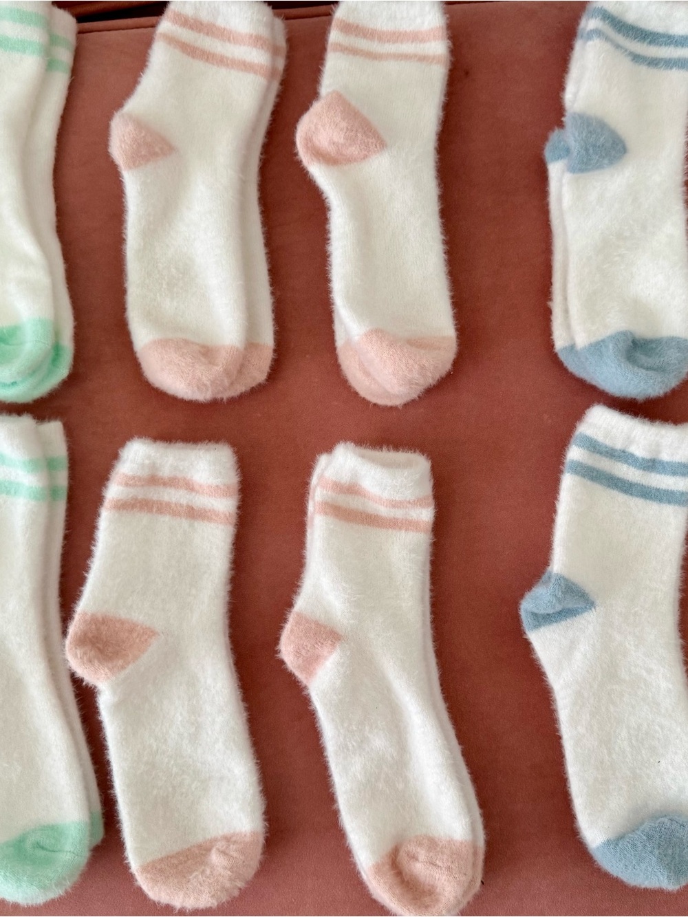 Cozy White Fuzzy Ankle Socks with Pastel Accents and Stripes